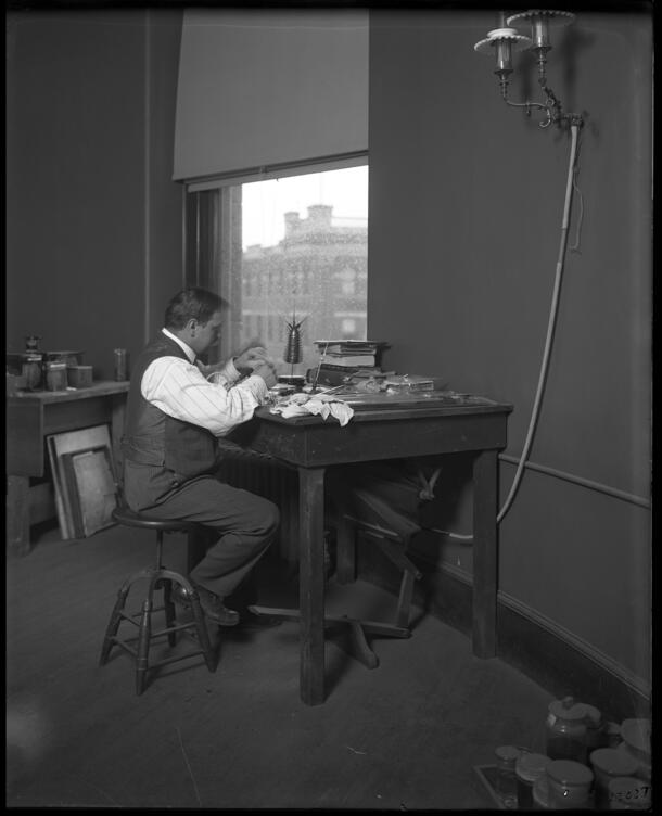 Herman O. Mueller, glassblower, working on an invertebrate model in the Department of Installation and Preparation, 1910