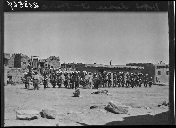 Group of men performing a Hopi dance at Hano, Navajo County, Arizona, 1916.