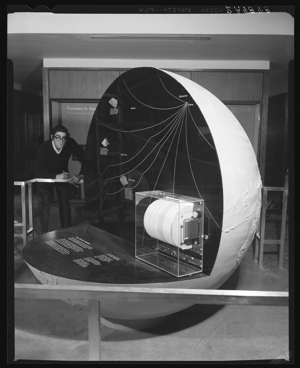 Photograph of Sidney Horenstein and Seismographic Globe, Hall of Earth History, 1969.