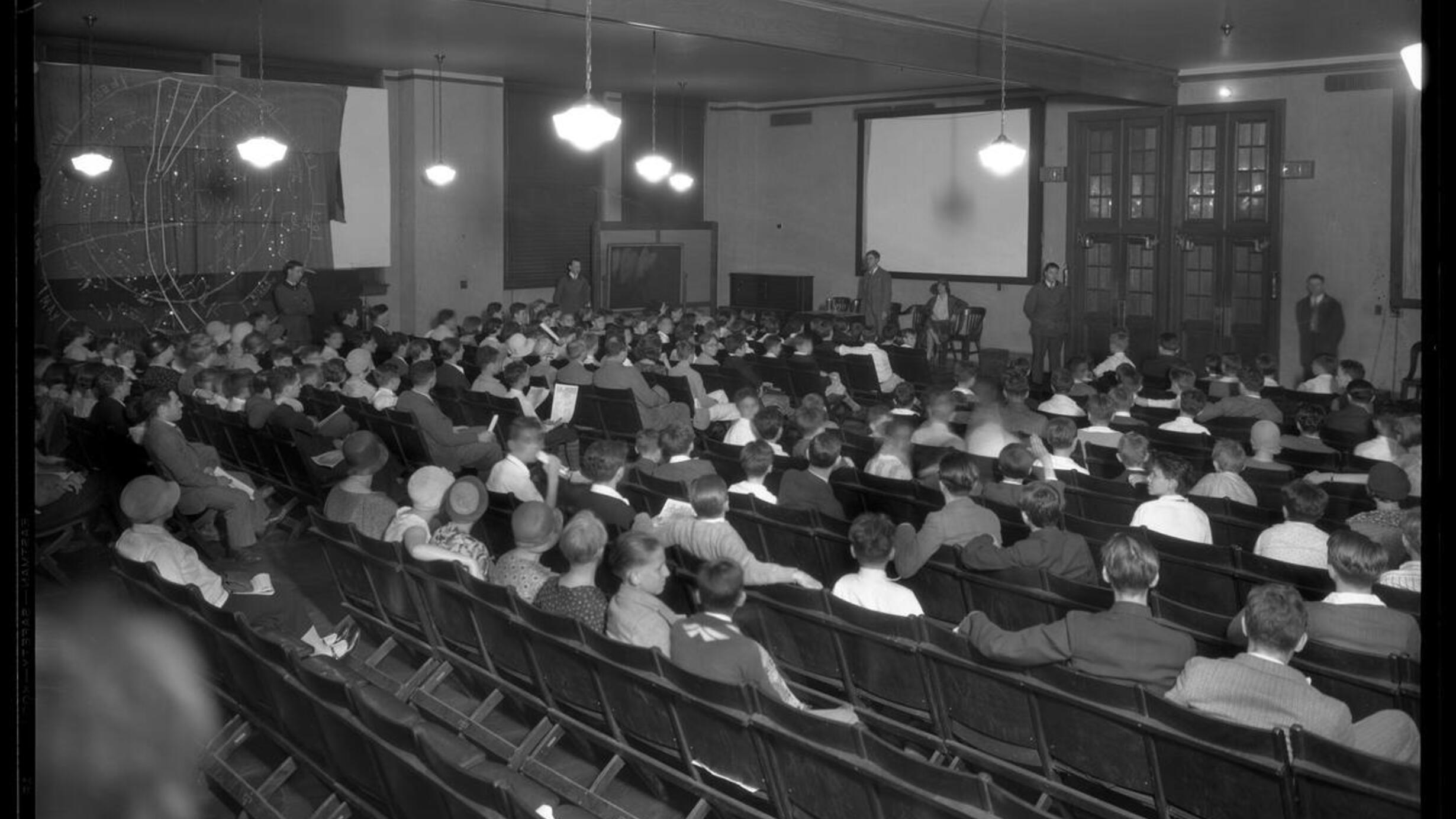 Junior Astronomy Club in session, Henry Herman presiding, Planetarium, American Museum of Natural History, circa 1930