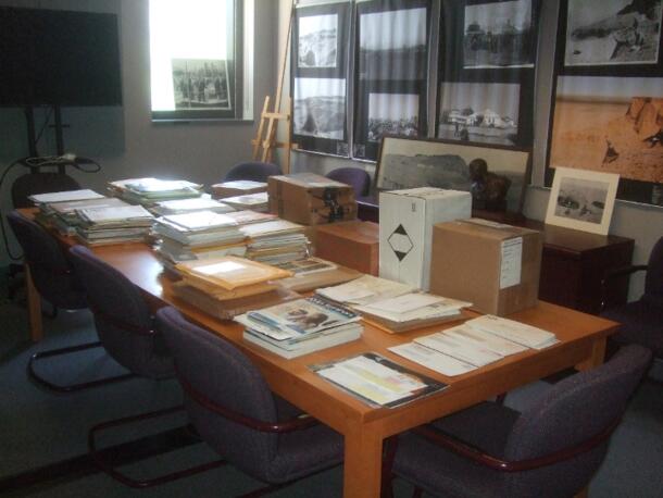 Photograph of the Library's conference room with unopened mail stacked on the table.