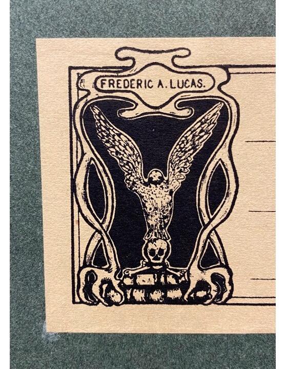 Image of former Museum Director Frederic A. Lucas' bookplate. Design has skull and crossbones, clawed feet and a bird with outstretched wings.