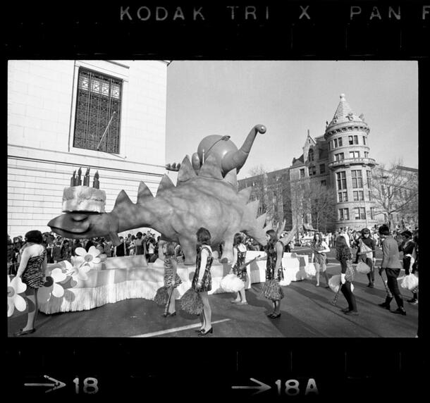 Image of dinosaur balloon and float, Macy's Parade, American Museum of Natural History, Central Park West and 77th Street, November 1969.