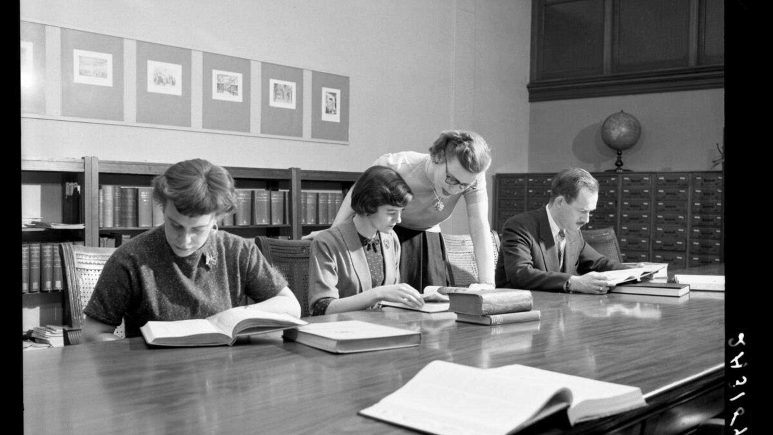 Image of patrons and librarian in AMNH Reading Room, Main Library, 1954