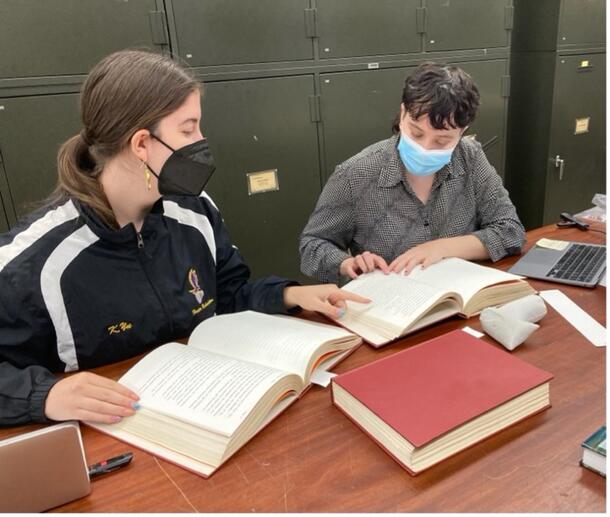 Interns Sarah Barlow-Ochshorn and Mandy Abokhair compiling the list of Vertebrate Paleontology expeditions, 2022