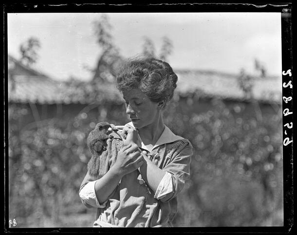 Yvette Borup Andrews with squirrel, China, September 20, 1916. AMNH Library - Image no. 228959