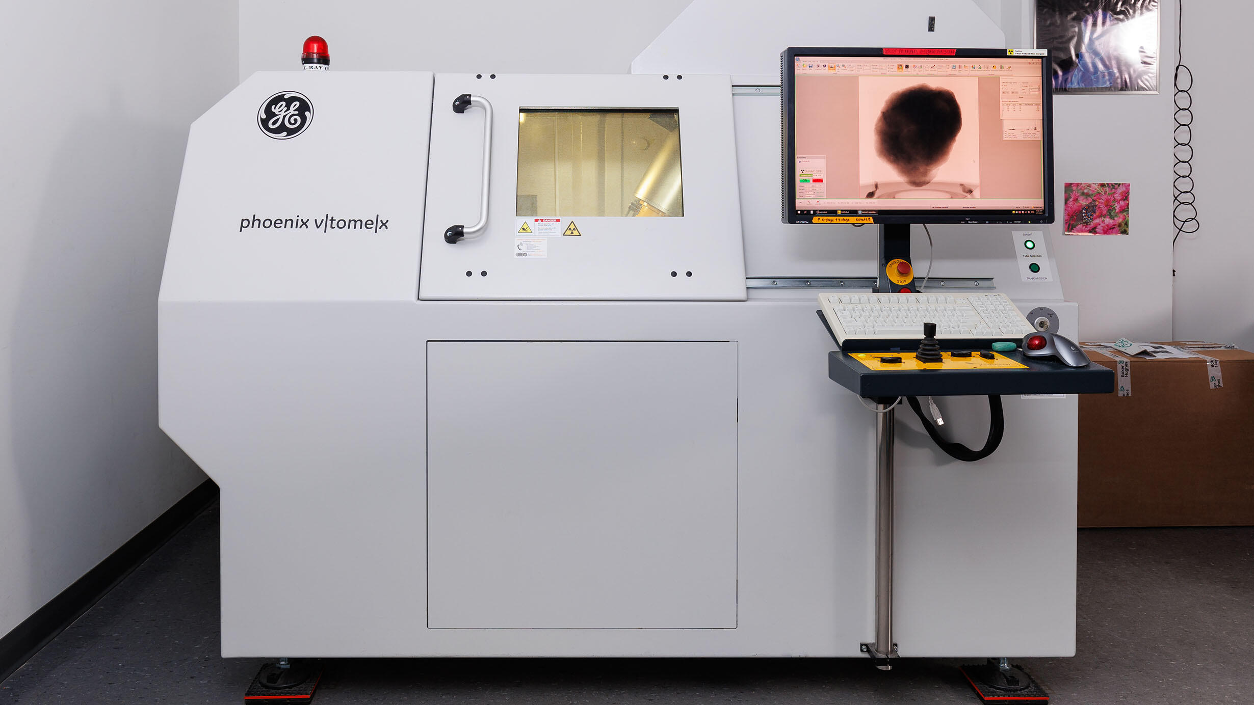 GE CT Scanner with a view on a computer of the object being scanned. 
