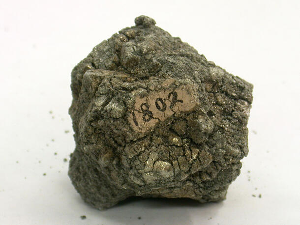 Mineral specimen with a label that reads 1802.
