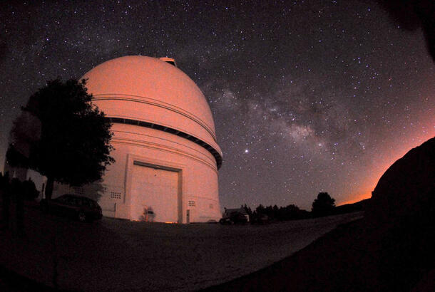 Exterior of the Palomar Dome at night.