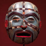 Painted ceremonial mask representing a human face.