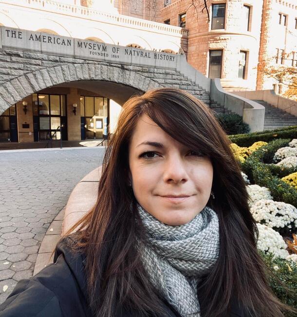 Rene Martin stands in front of the 77th street entrance of the American Museum of Natural History.