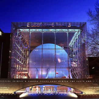 Hayden Planetarium exterior at night.