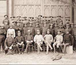 Group photo of about 40 Rough Riders, seated and standing in rows. 