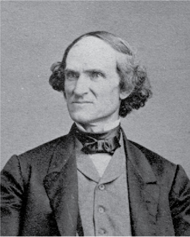 Taxidermist John Bell, photographed from the chest up.