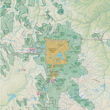 Map of Yellowstone National Park represented in one color, and the greater Yellowstone area surrounding it represented in a different color.