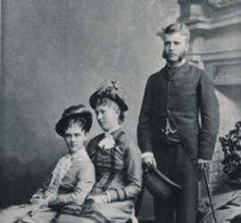 Alice Hathaway Lee (seated, to the left), Theodore Roosevelt (standing on the right) and a third person seated beside Alice.