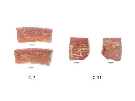 Four potsherds with an orange-reddish surface.