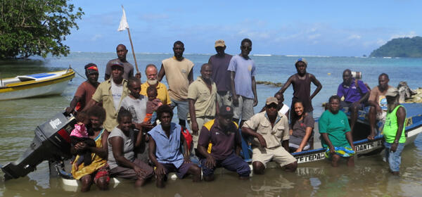 Tetepare rangers gathering on a beach