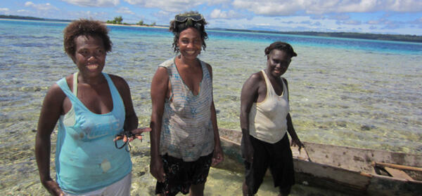 Women gathering shellfish in the Solomon Islands